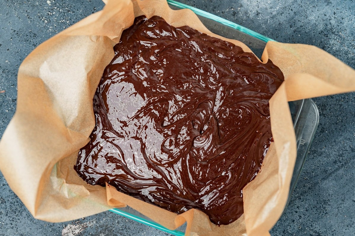 melted chocolate truffle in a parchment lined pan