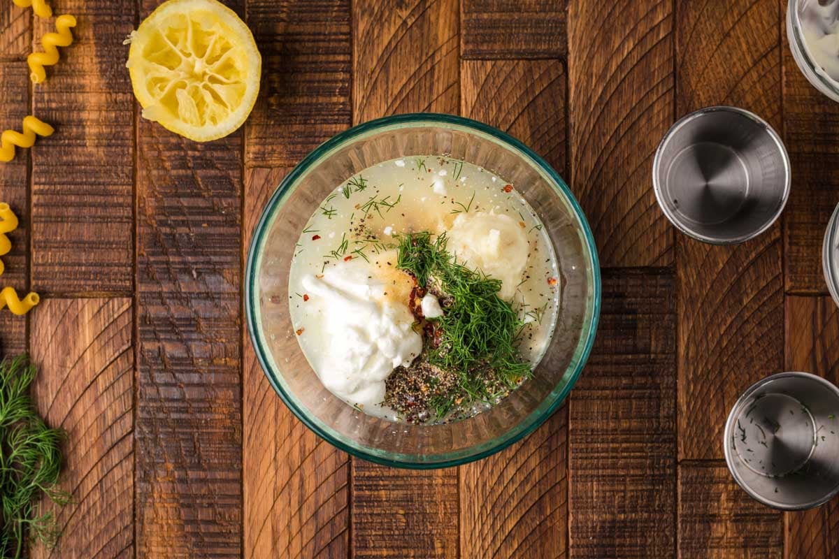 ingredients for dill sauce in a glass bowl