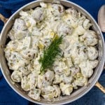 overhead view of creamy dill potato salad in a pan