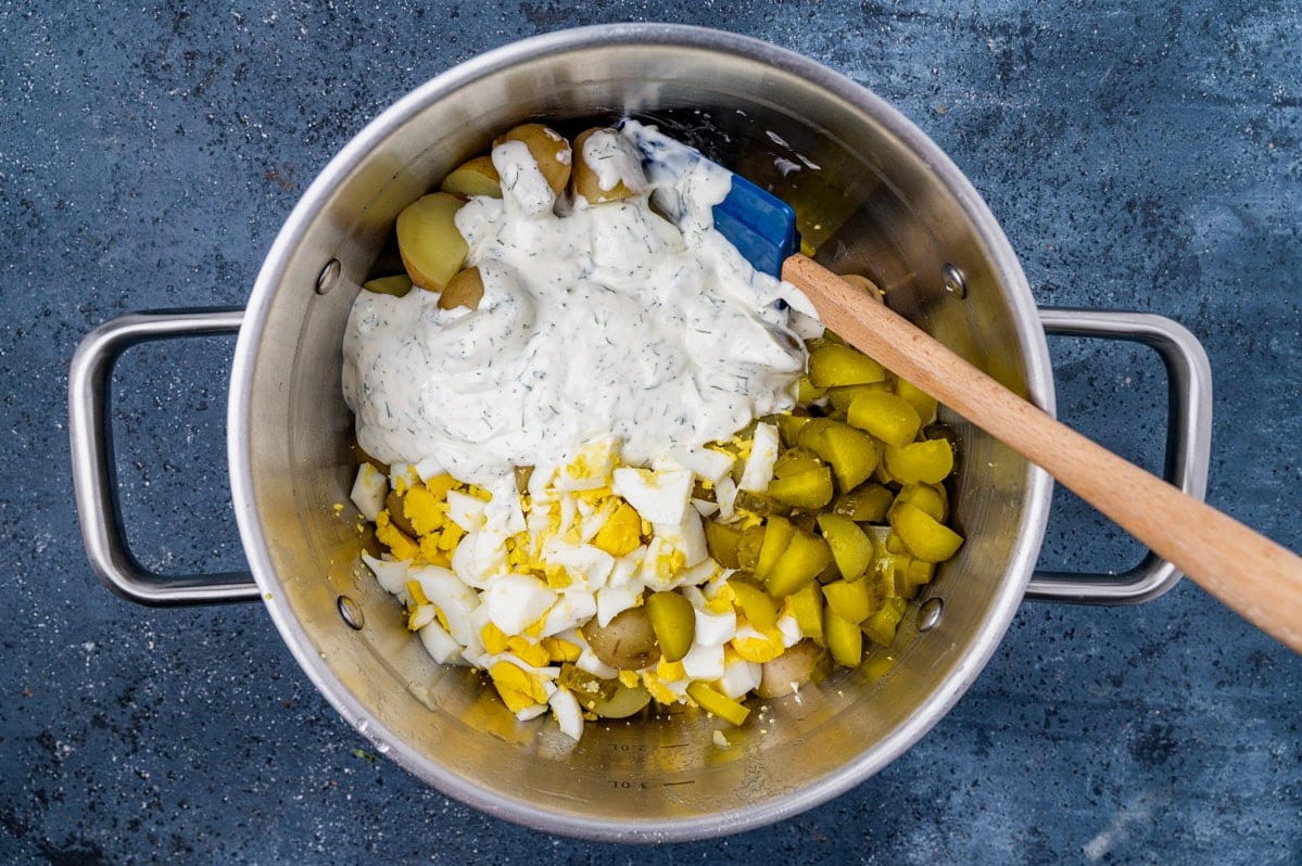 unmixed dill pickle potato salad in a saucepan