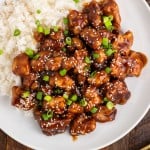 overhead view of a plate of general tso's chicken and rice