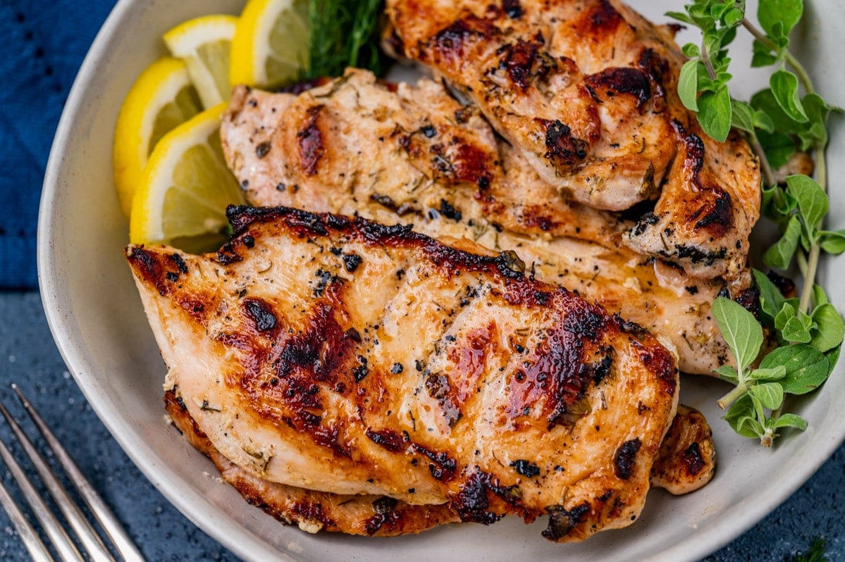 a plate of grilled chicken with greek marinade