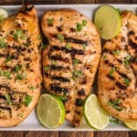 3 grilled key west chicken breasts on a platter