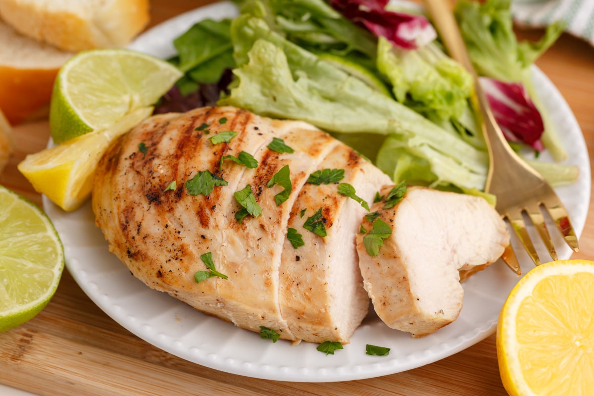 grilled chicken and a salad on a plate