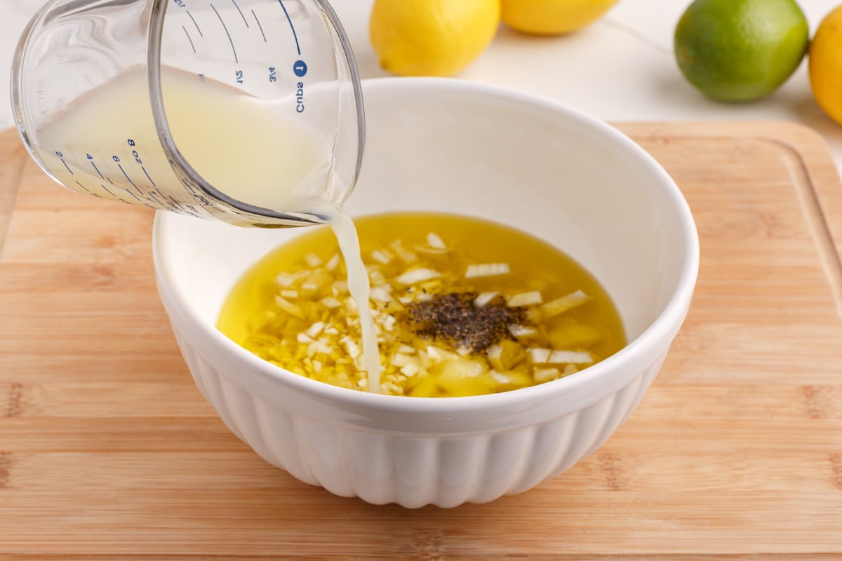 lemon juice pouring in a bowl