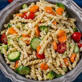 pasta salad with poppy seed dressing and vegetables in a bowl