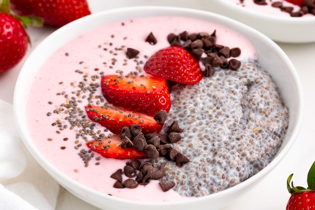 strawberry chia seed smoothie bowl on a table