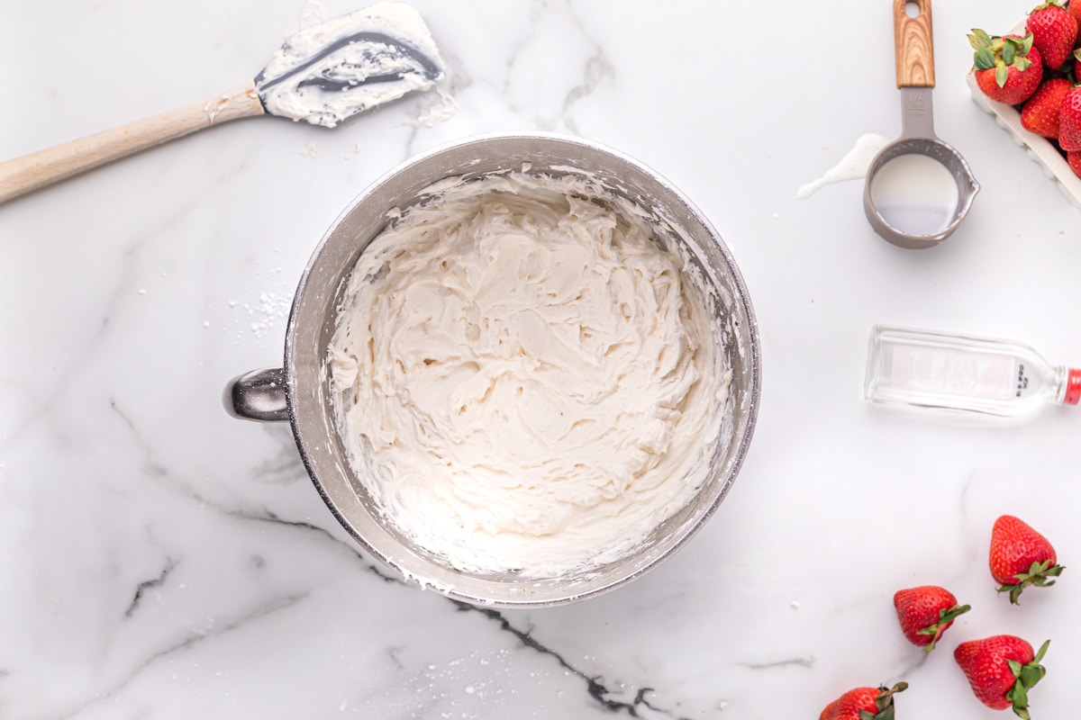 white frosting in a mixing bowl