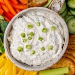 overhead view of a bowl of vegetable dip with green onion