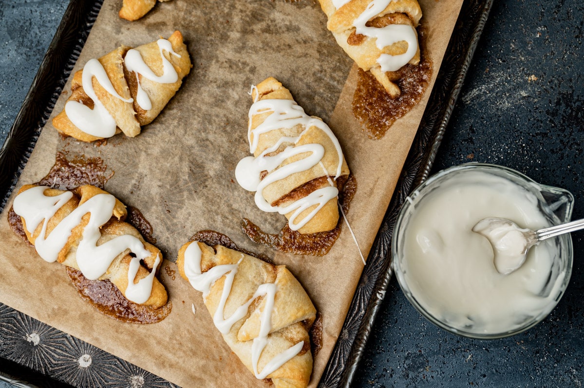 overhead view of crescent cinnamon rolls with glaze