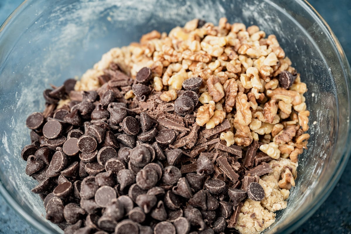 chocolate chips and walnuts in a mixing bowl