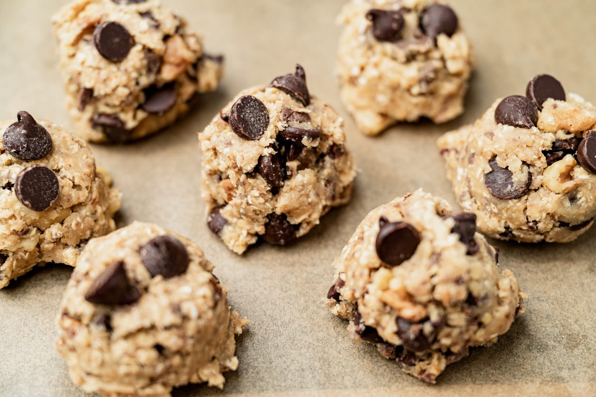 balls of cookie dough on parchment paper