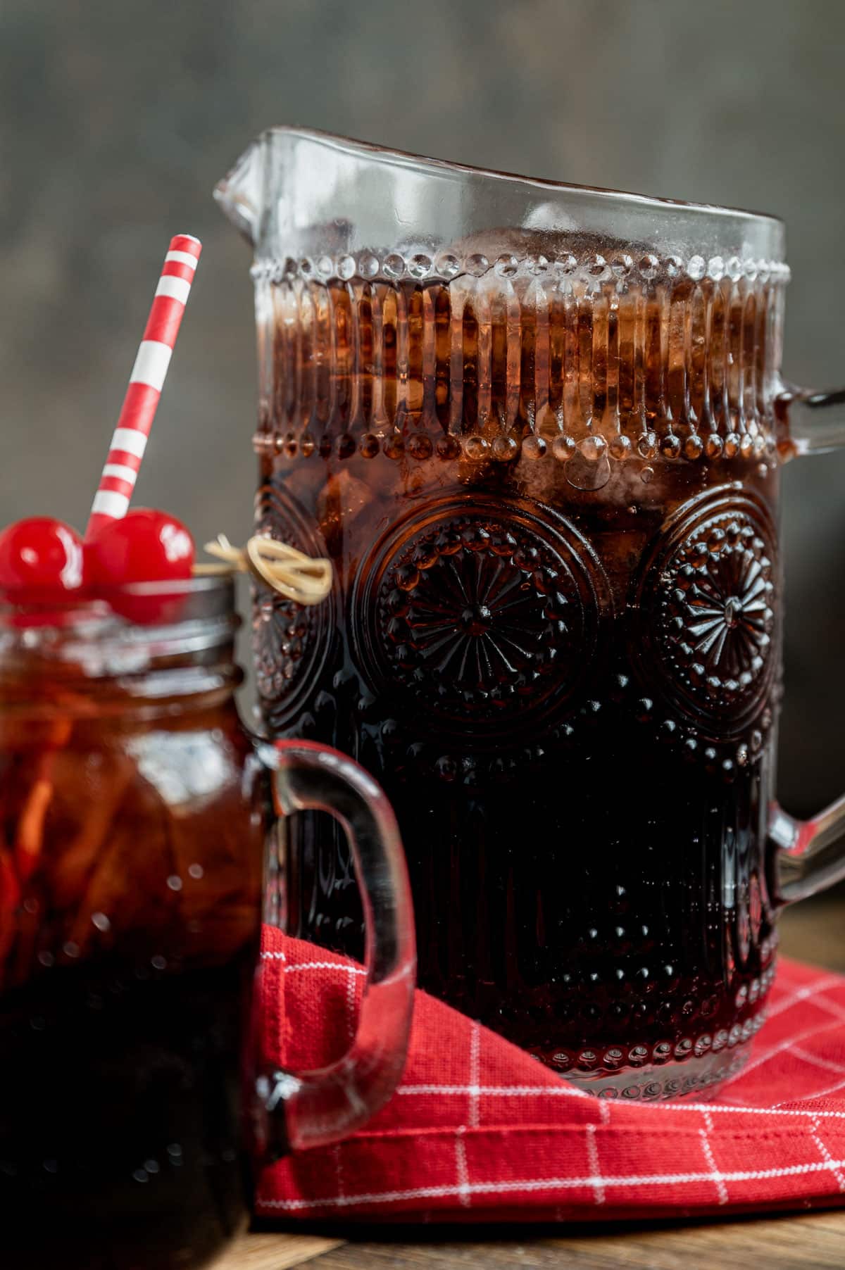 a pitcher of cherry cola
