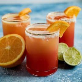 a sunrise mocktail with a salt rimmed glass