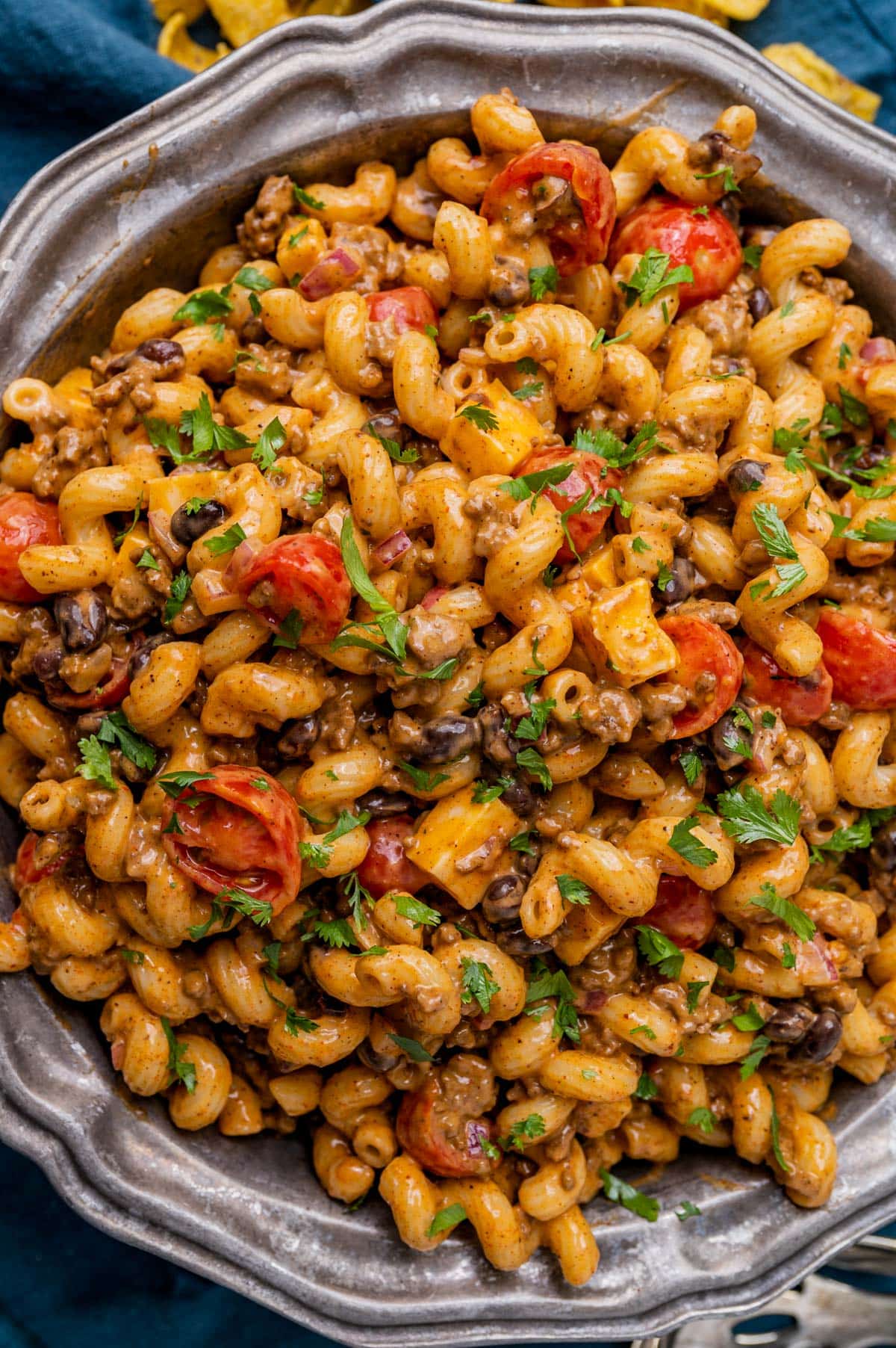 an overhead view of a big bowl of taco pasta salad