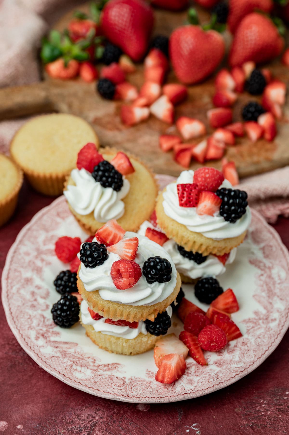 3 triple berry cornbread shortcakes on a plate