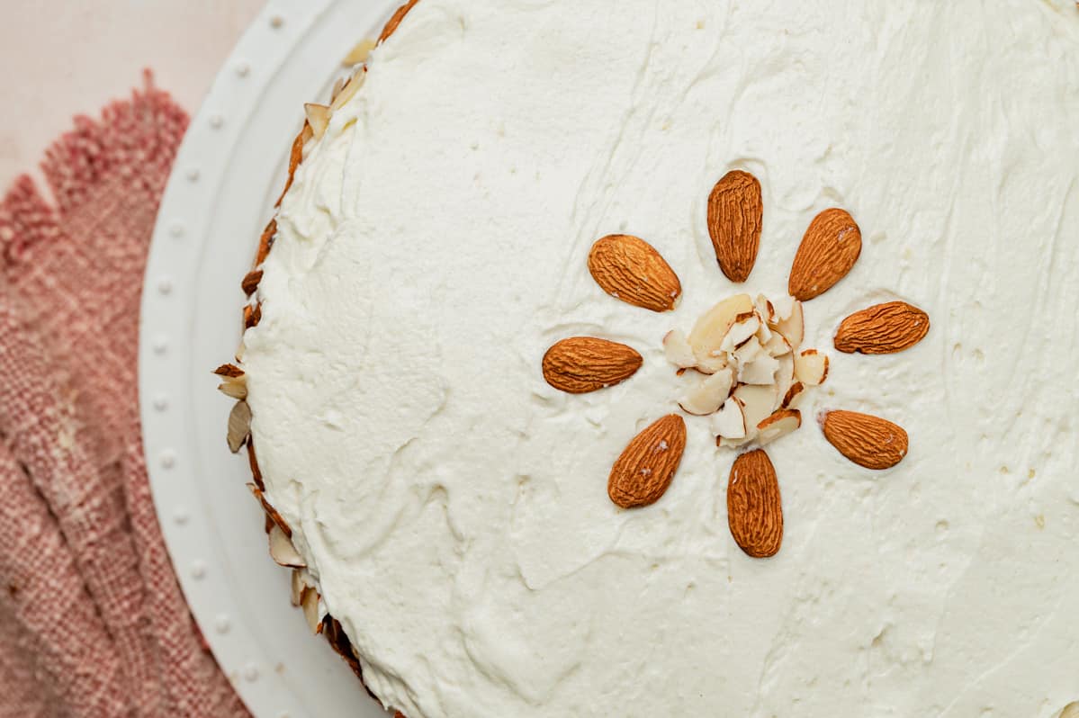 overhead view of almond cream cake with almonds on top