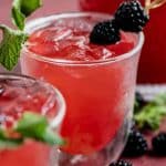 raspberry mint lemonade with blackberries in a glass
