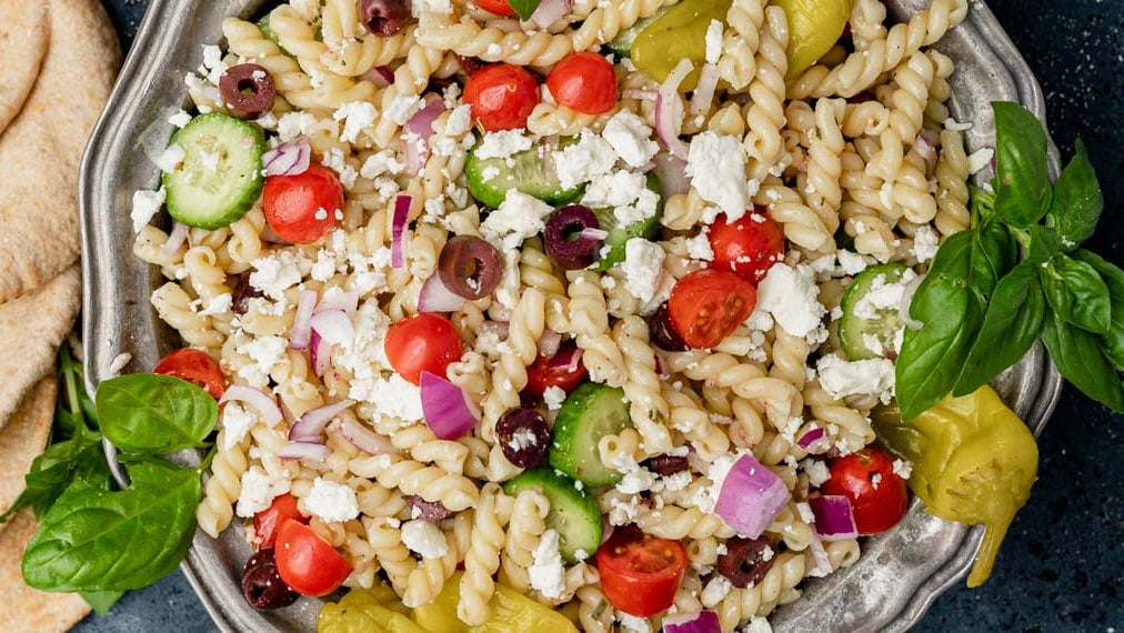 overhead view of a bowl of greek pasta salad