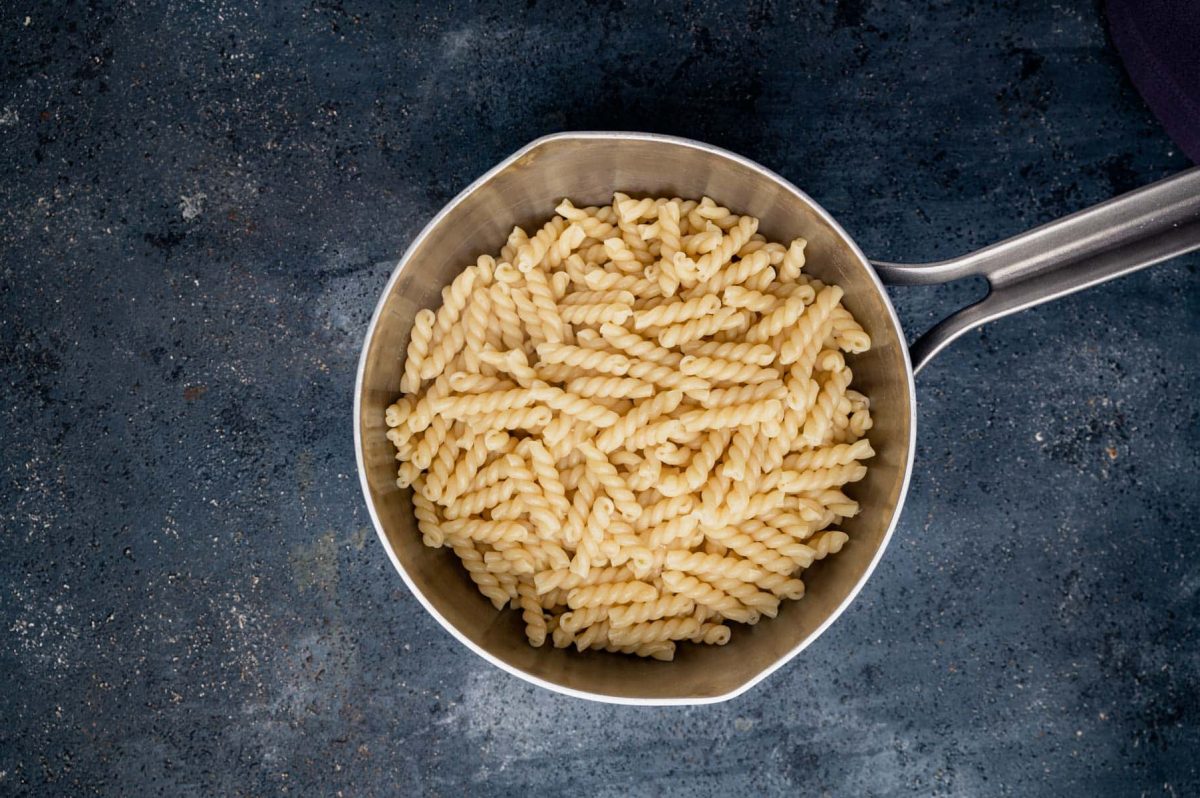 gemelli pasta in a sauce pan