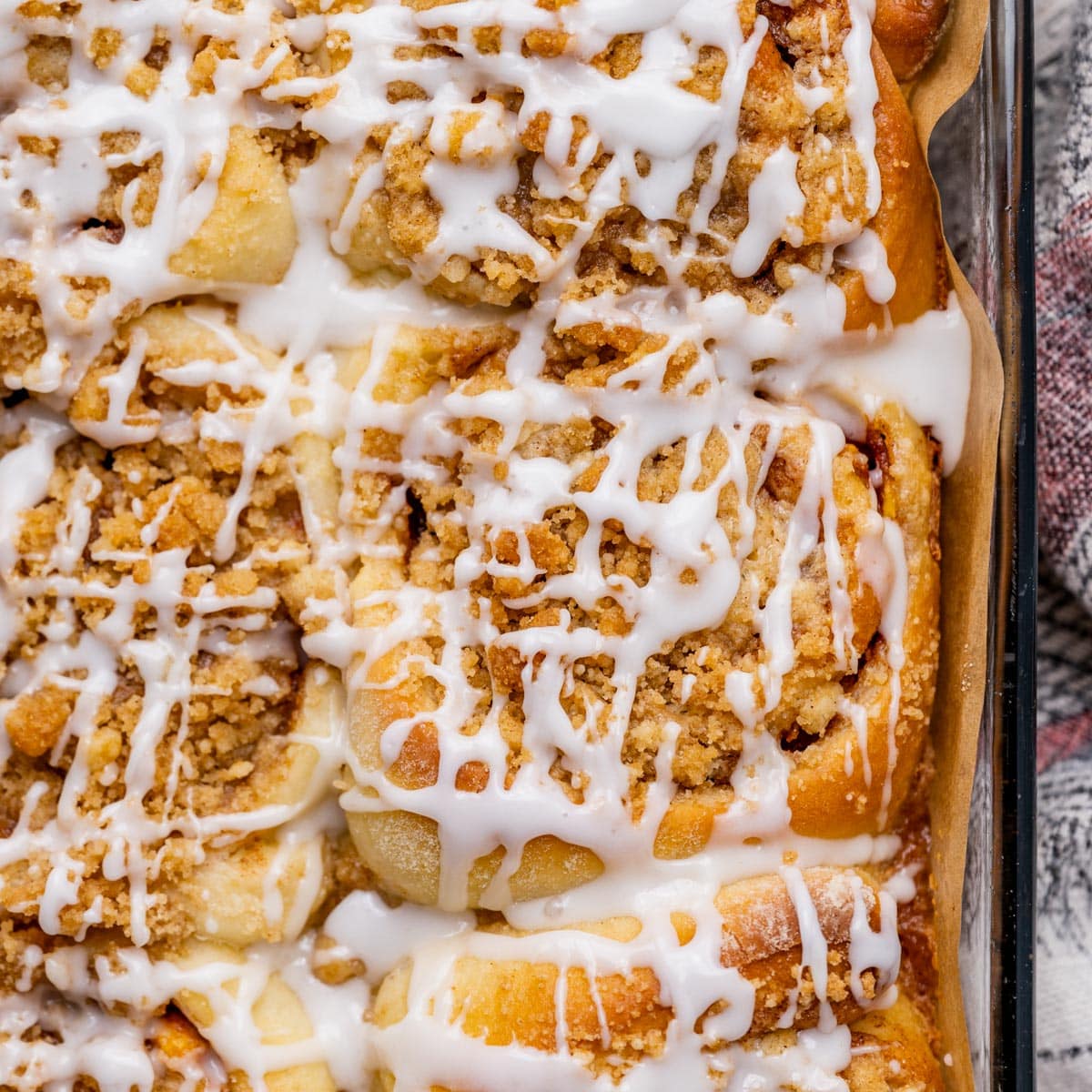 overhead view of peach cinnamon rolls in a pan