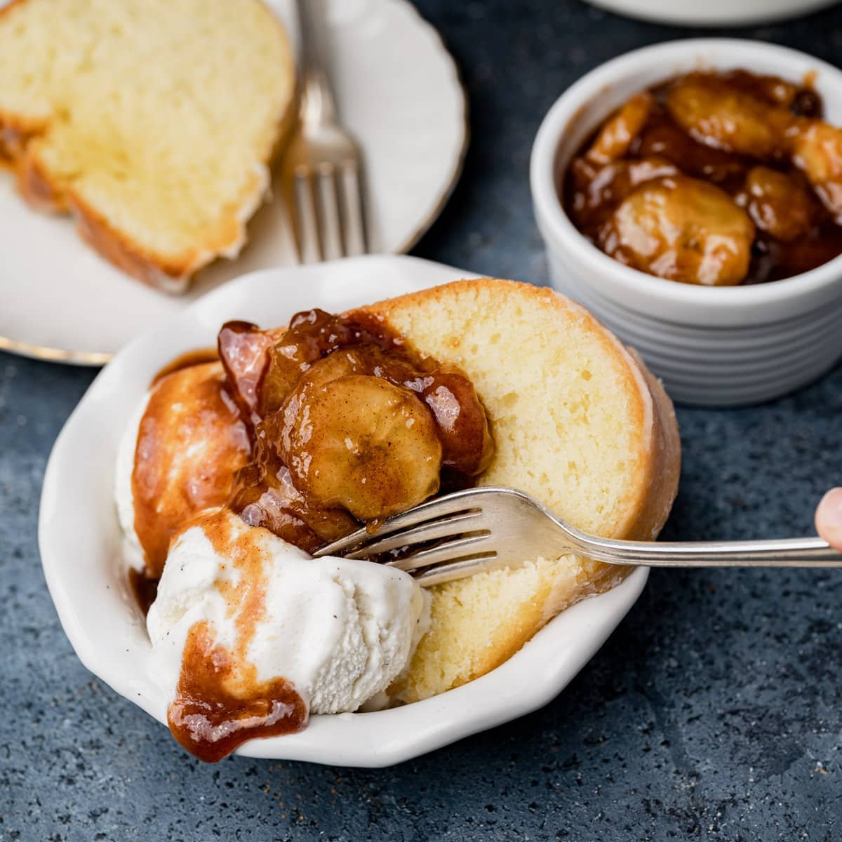 pound cake in a bowl with ice cream and caramelized bananas