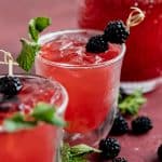 raspberry mint lemonade with blackberries in a glass