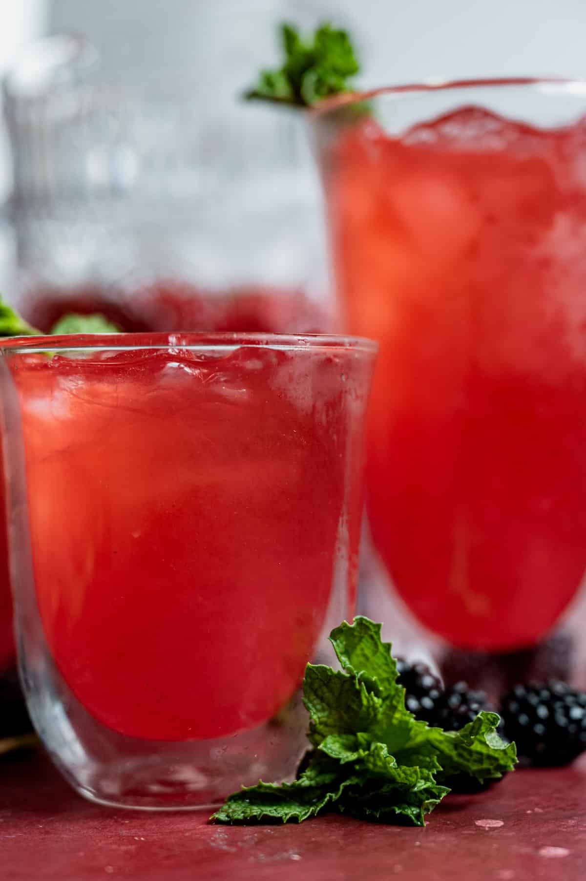 red raspberry mint lemonade in a glass