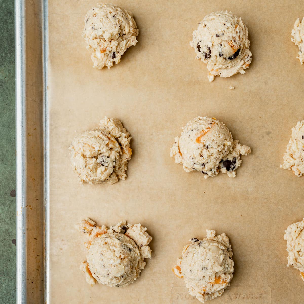 unbaked cookie dough on a baking sheet