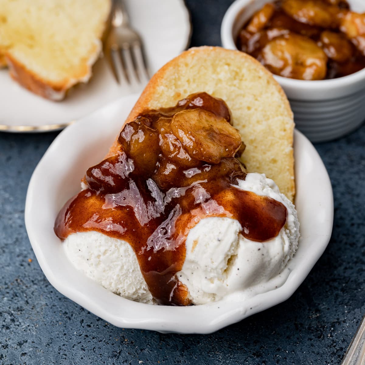 a bowl of pound cake, ice cream and brown sugar bananas