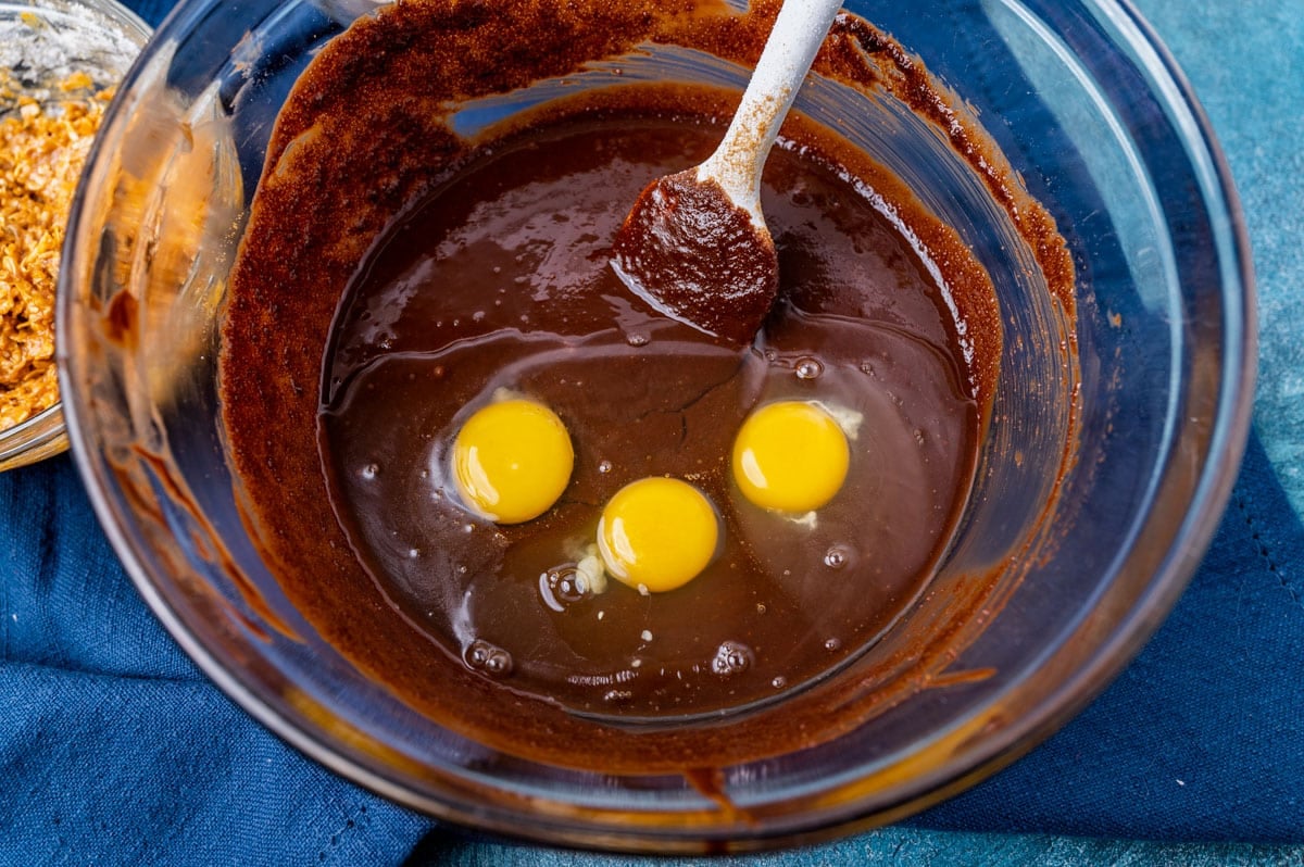 eggs over brownie batter in a bowl