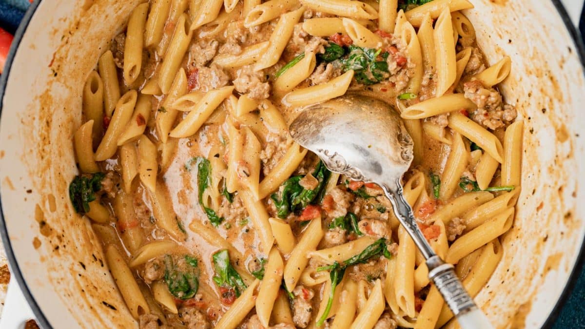 overhead view of creamy pasta skillet with a spoon in it