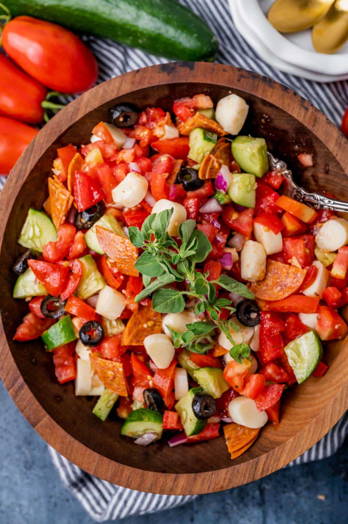 overhead view of a bowl of tomato salad with cucumber
