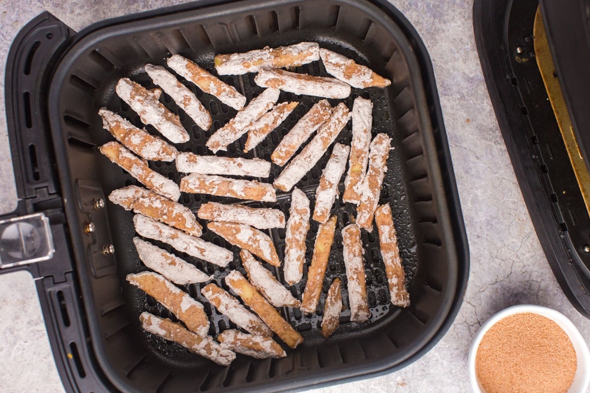 apple fries uncooked in an air fryer