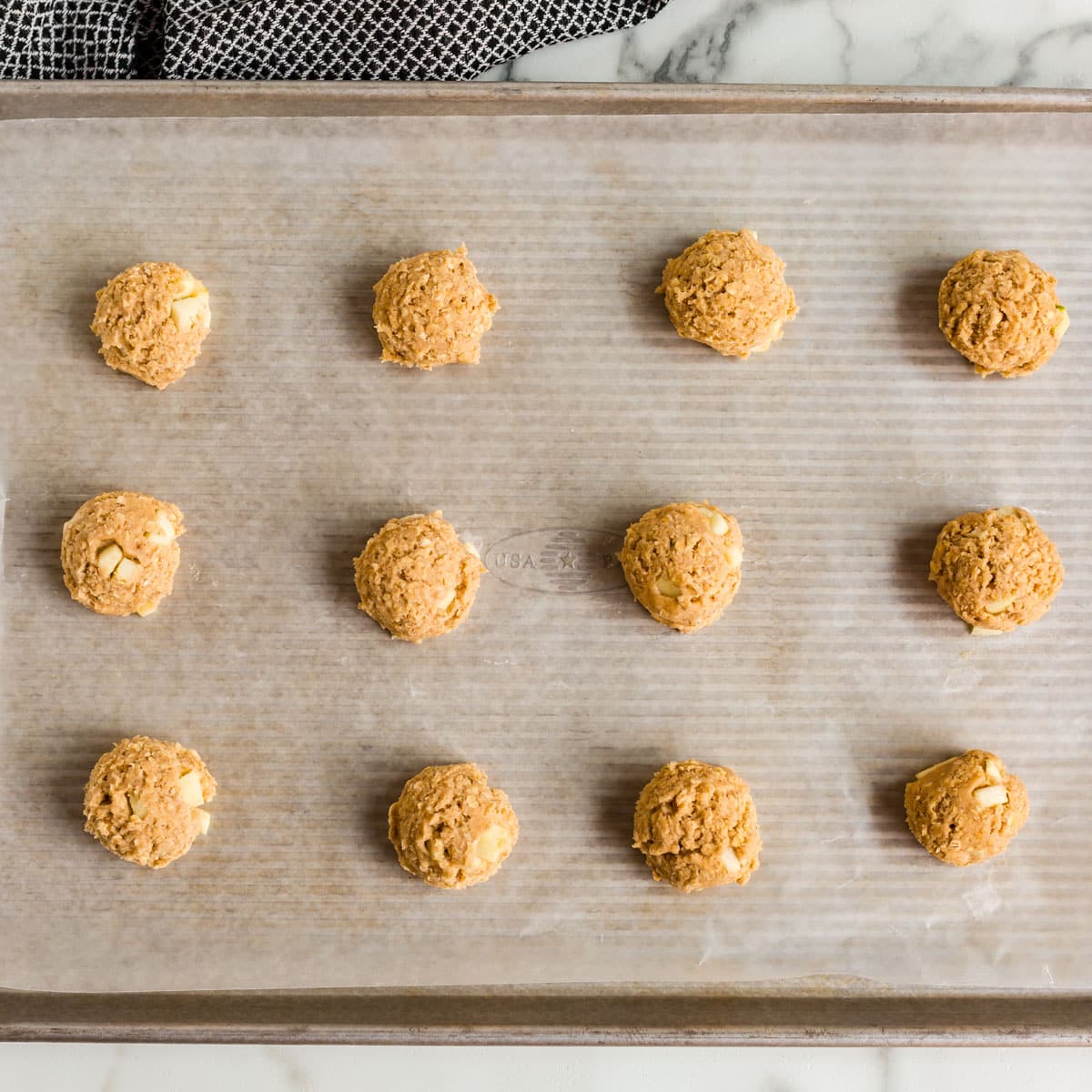 unbaked apple oatmeal cookies on a pan