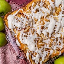 glazed apple crumble cinnamon rolls in a 9x13 pan