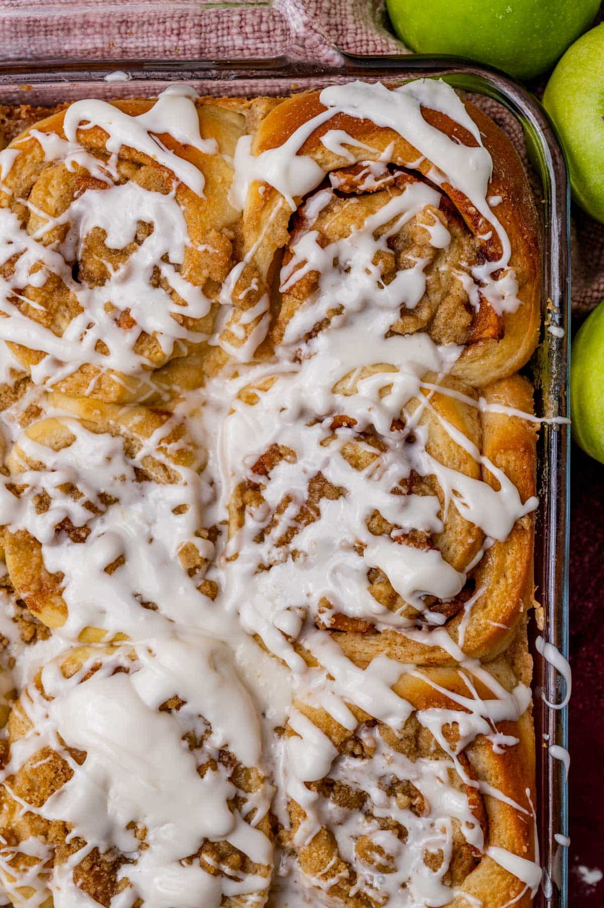 a pan full of apple crumble cinnamon rolls