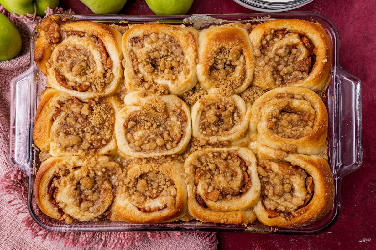 baked apple crumble cinnamon rolls in a pan