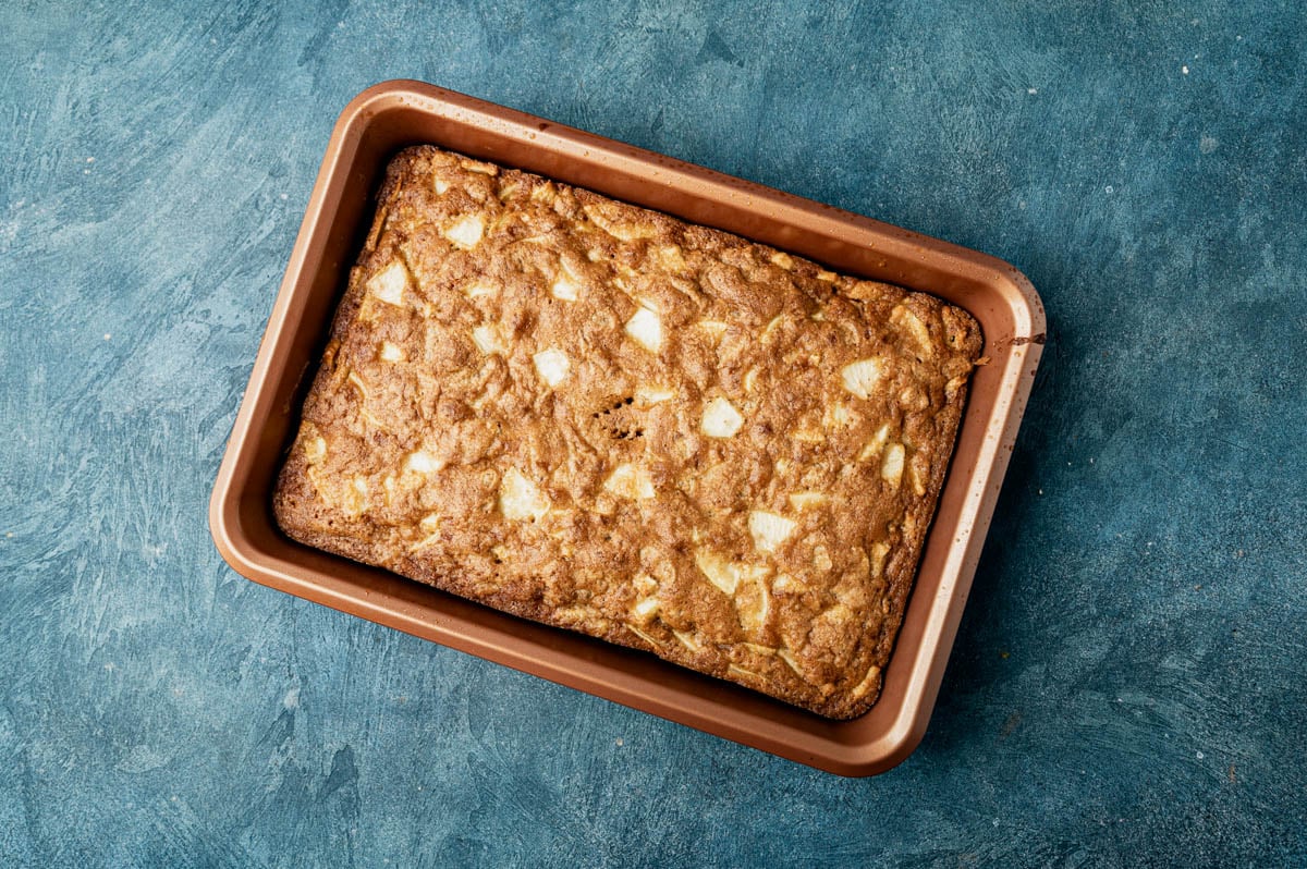 baked apple walnut cake in a 9x13 pan