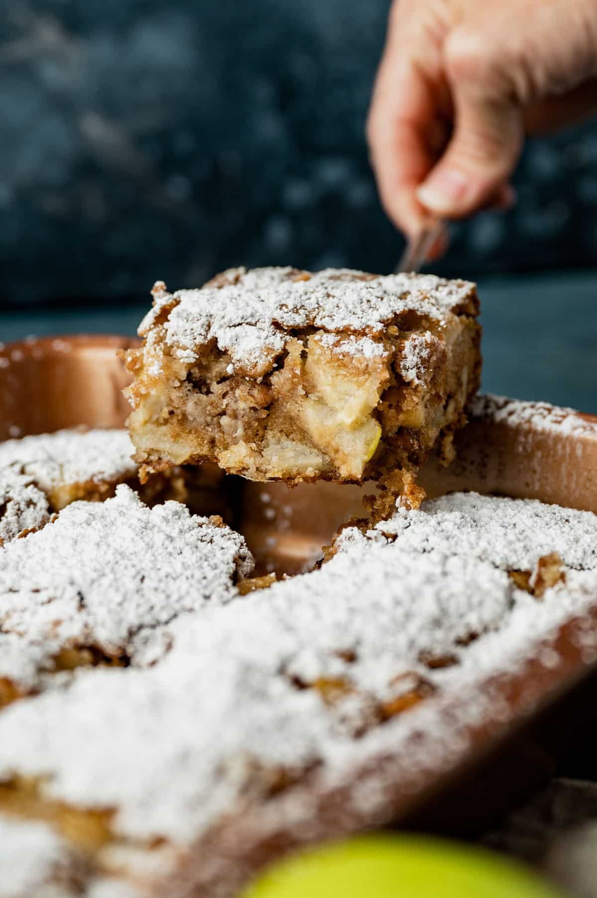 apple walnut cake on a spatula