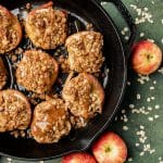 overhead view of apple crumble baked apples with caramel drizzled on top