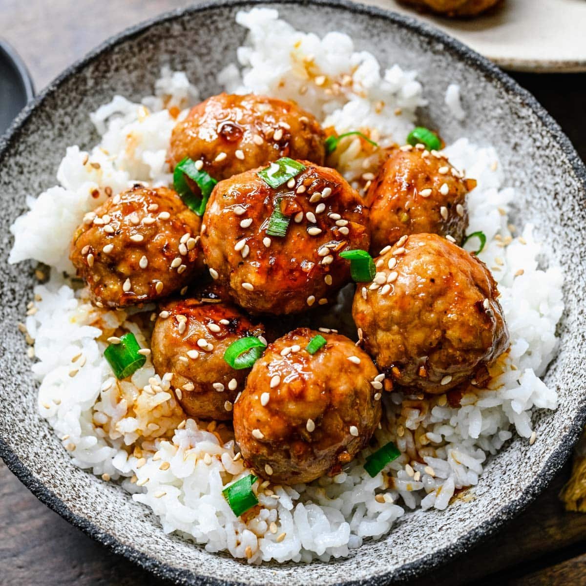 a plate of teriyaki turkey meatballs with rice