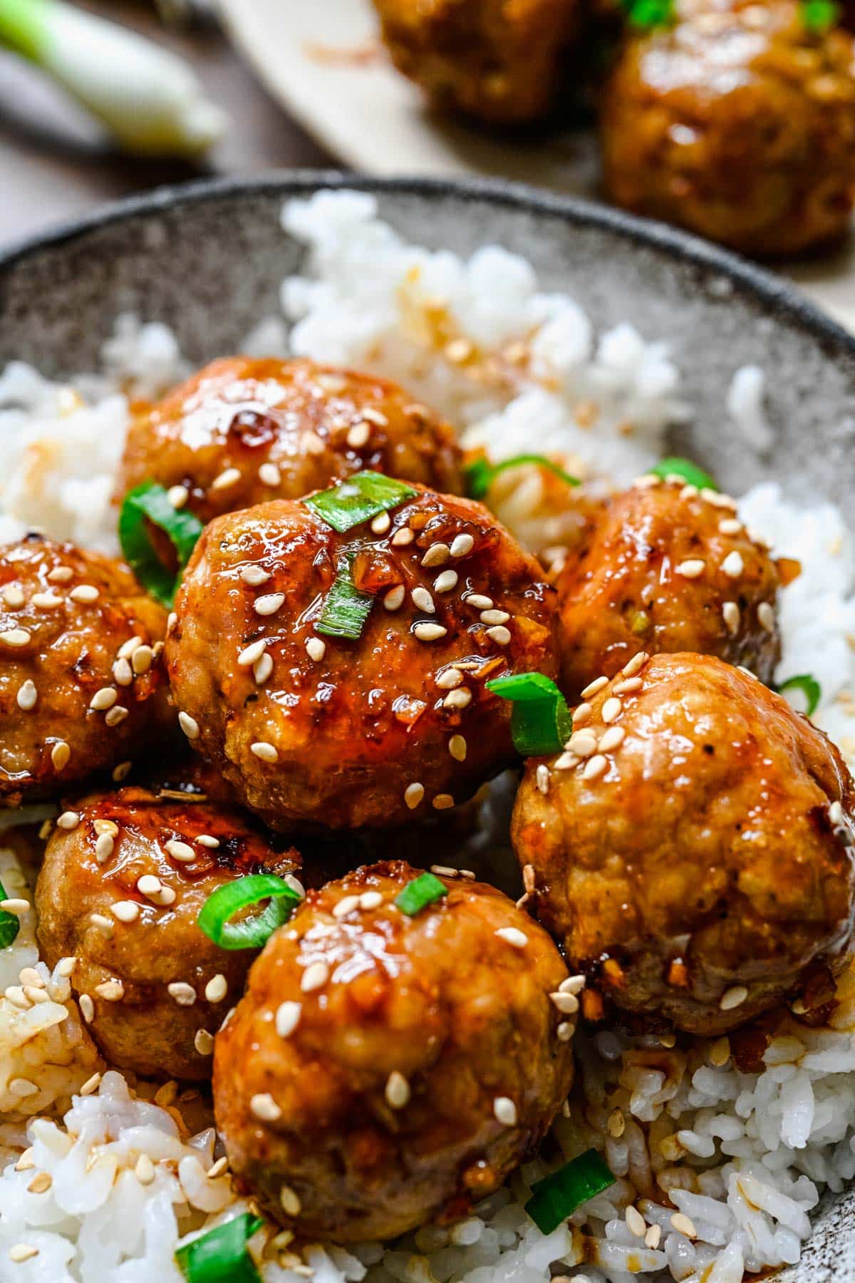 a plate of teriyaki turkey meatballs with rice