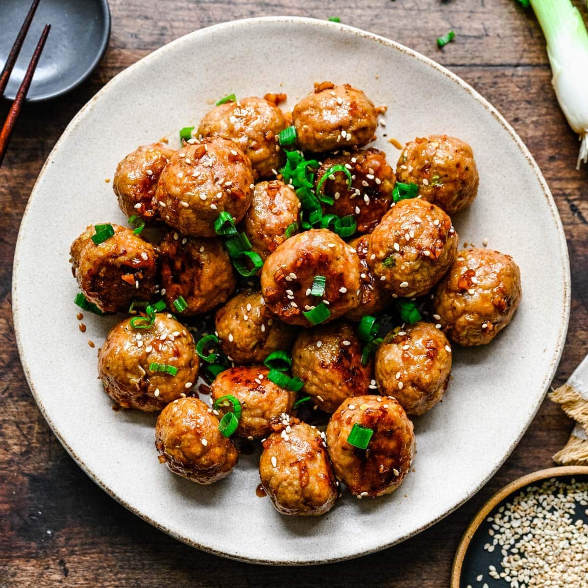 a plate of baked turkey meatballs with teriyaki sauce