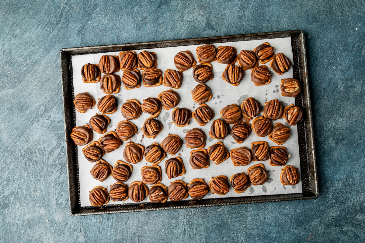 overhead view of pretzel turtles on a baking pan