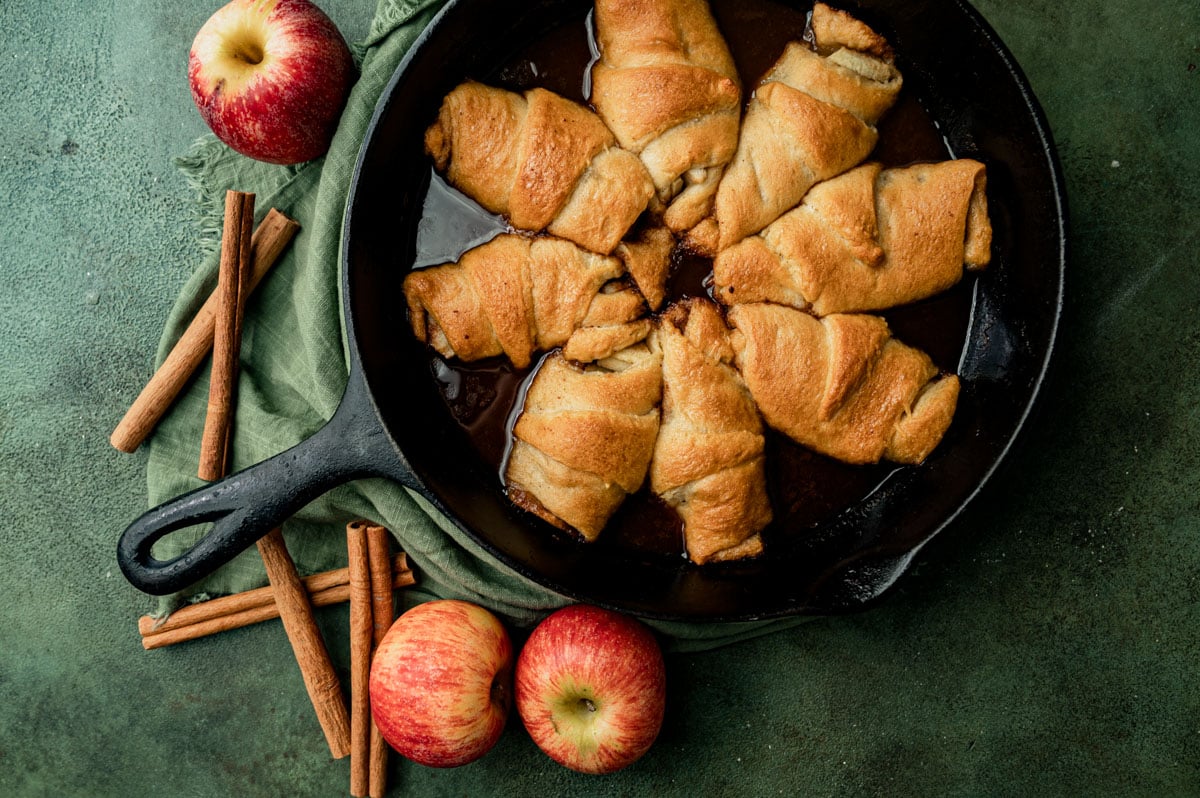 crescent roll apple dumplings baked in a cast iron skillet