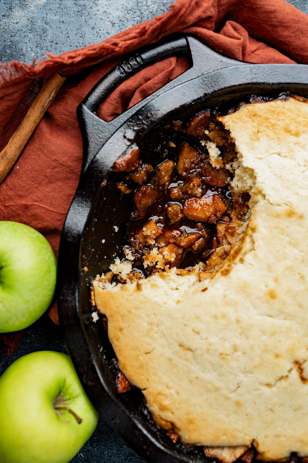 fried apples with molasses and cobbler topping baked in a skillet