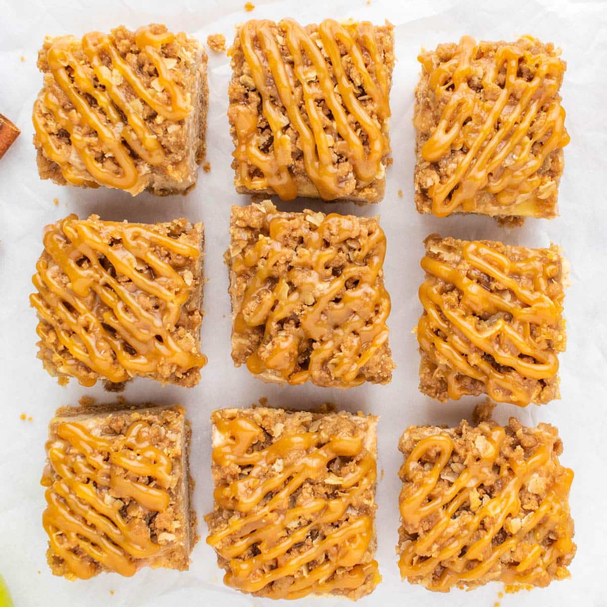 overhead view of caramel apple cheesecake bars cut into squares