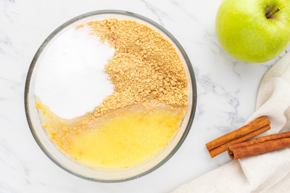 ingredients for graham cracker crust in a bowl