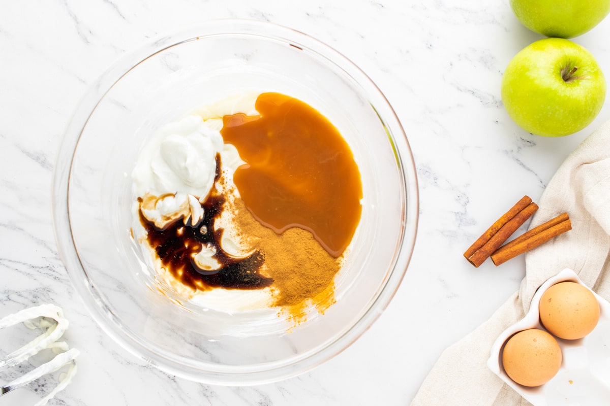 caramel, vanilla and cinnamon in a mixing bowl with sour cream